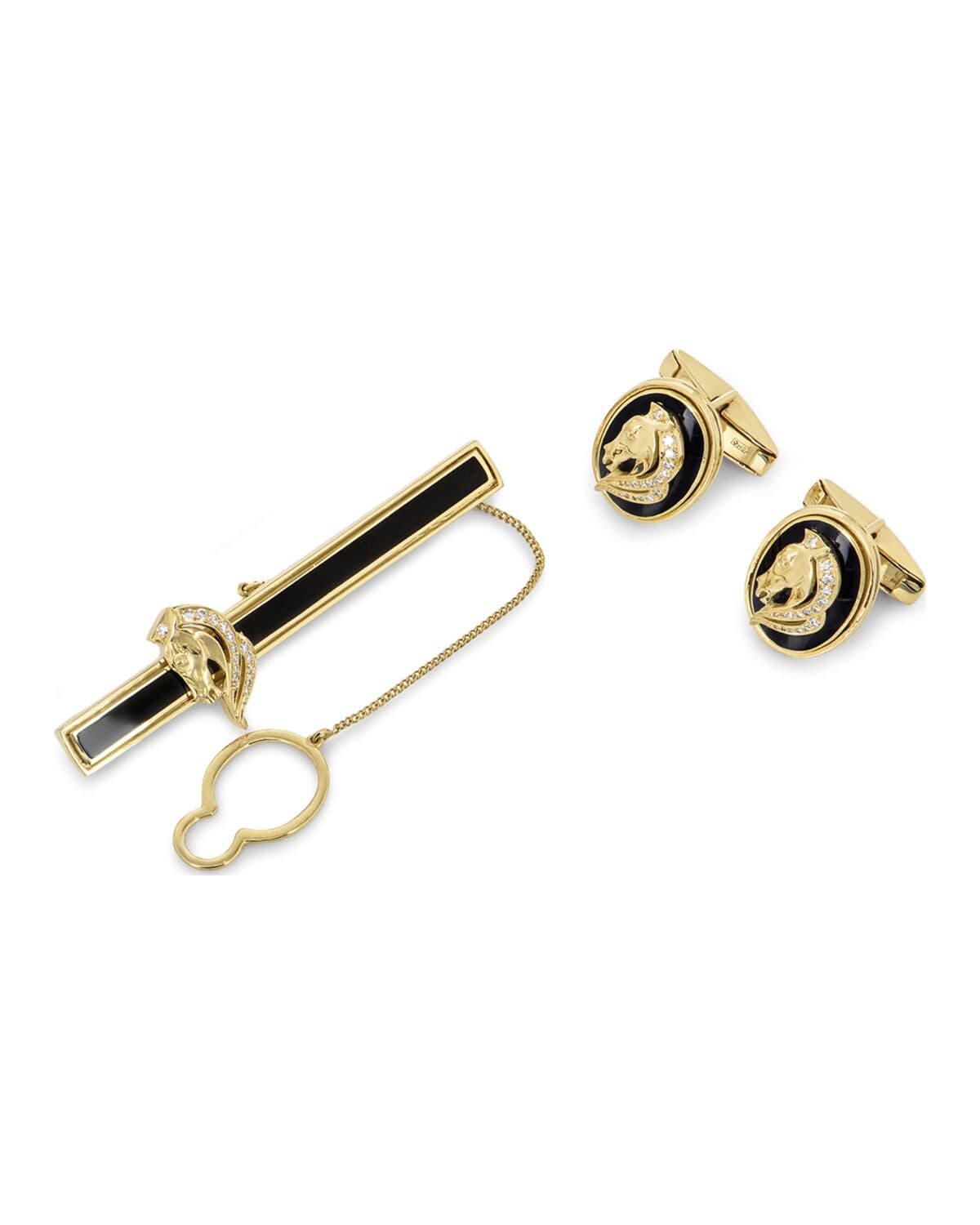 Tie bar and cufflinks photographed on a neutral ground