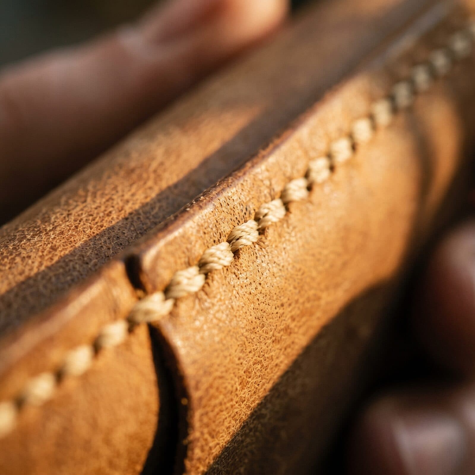 Saddle stitching examined up close — one of the details a second pass reads.
