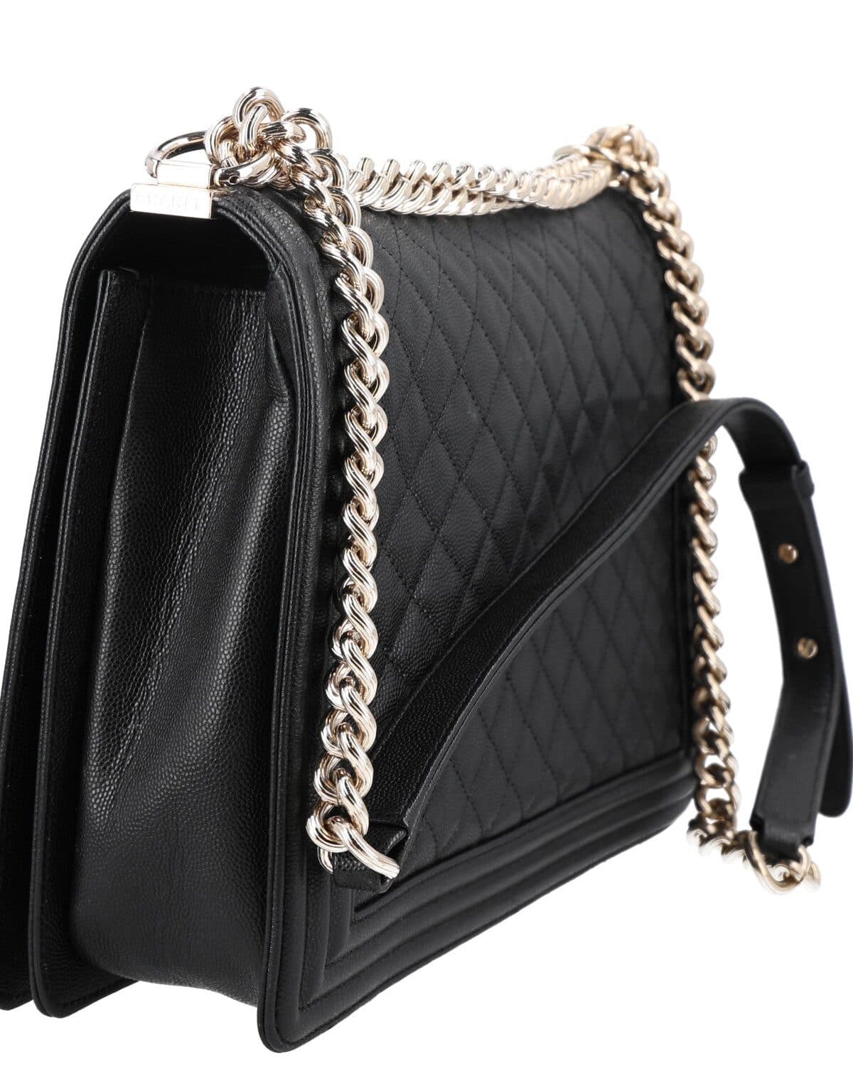 Quilted flap bag photographed on a neutral ground