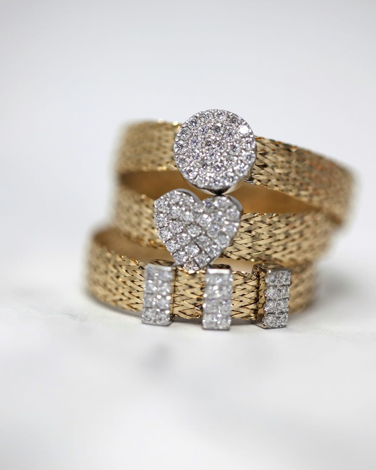 Yellow-gold signet ring photographed on a neutral ground