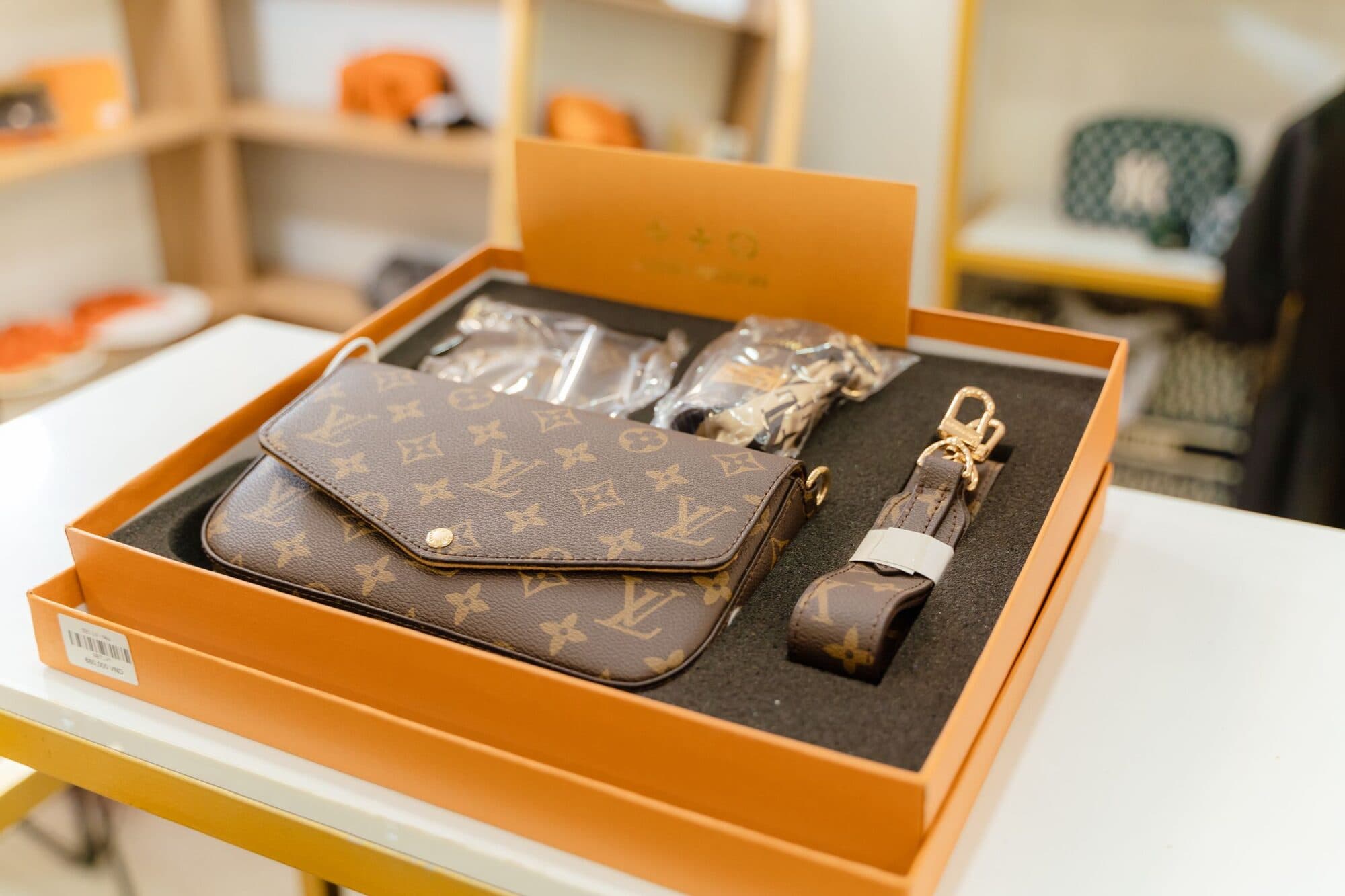 Wallets and card holders arranged on a warm neutral ground