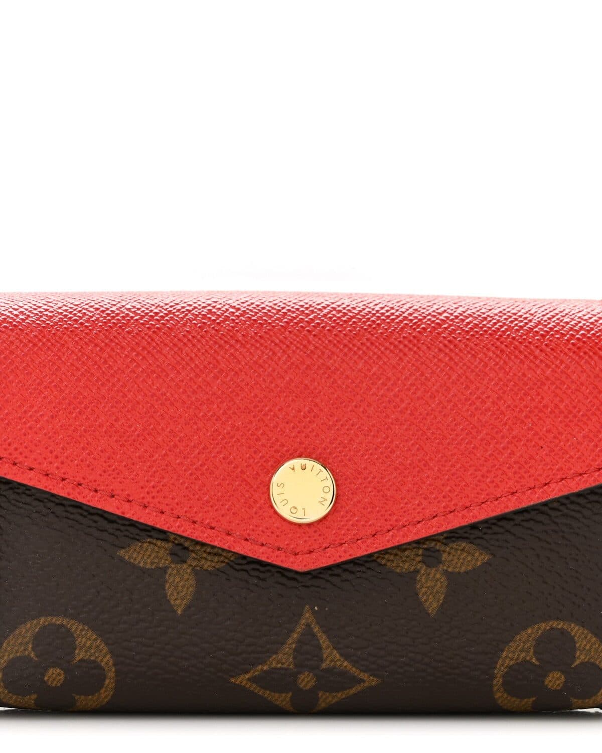 A Louis Vuitton monogram canvas wallet with a red leather envelope flap