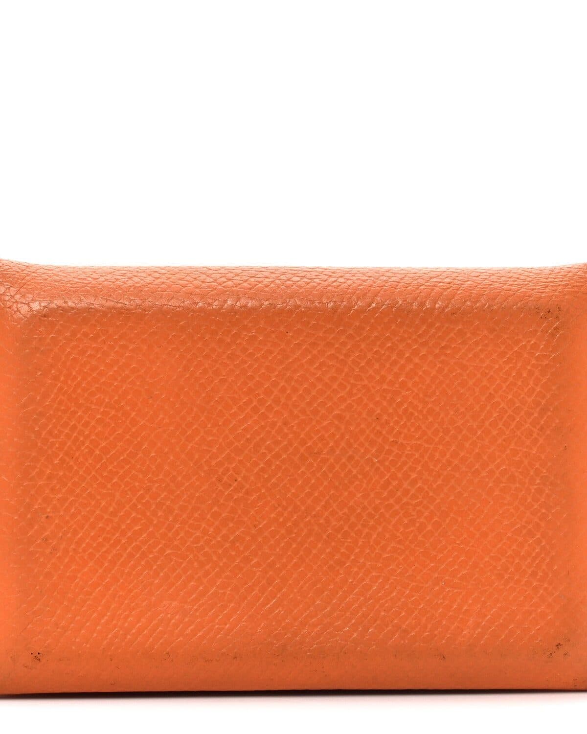 Zipped coin purse photographed on a neutral ground