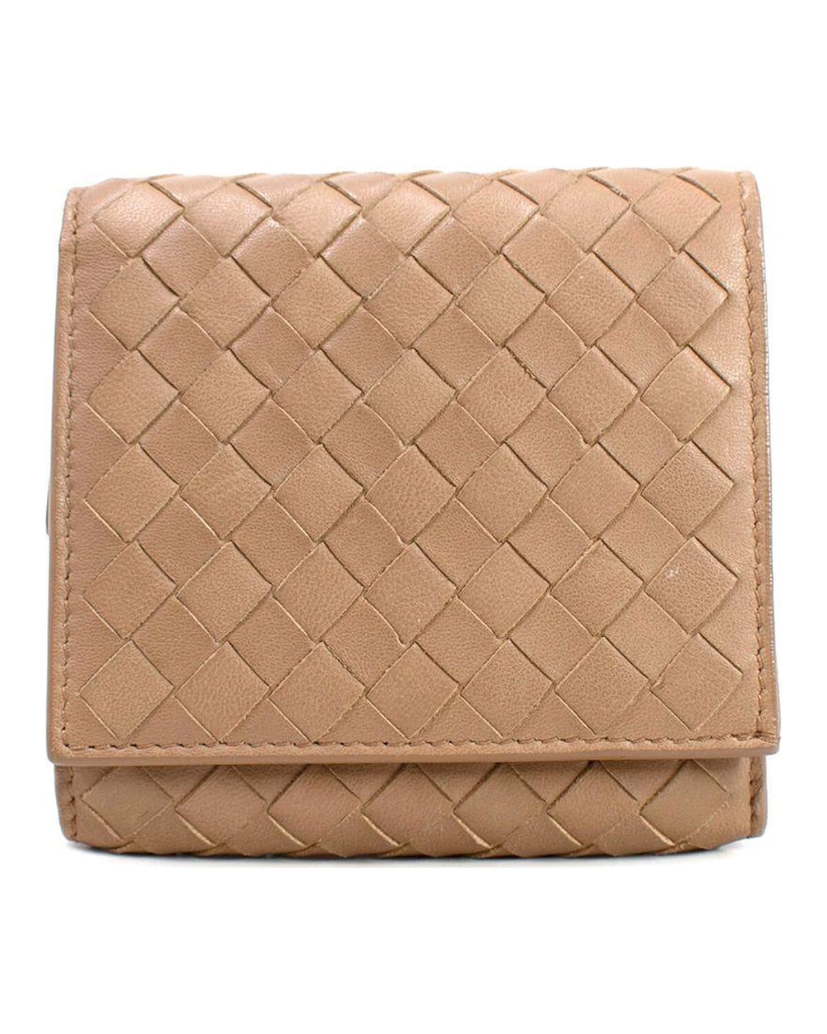 Woven leather trifold wallet photographed on a neutral ground