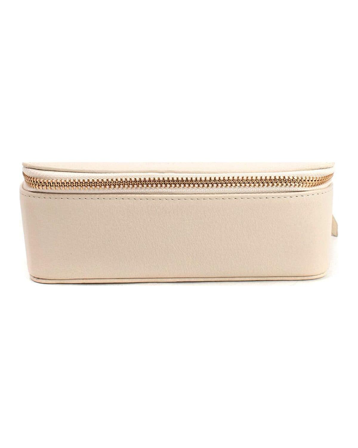 Leather travel case photographed on a neutral ground